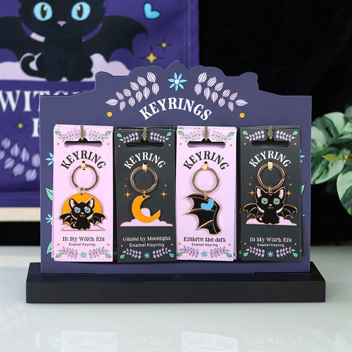 Set of 24 Cute and Creepy Keyrings on Display